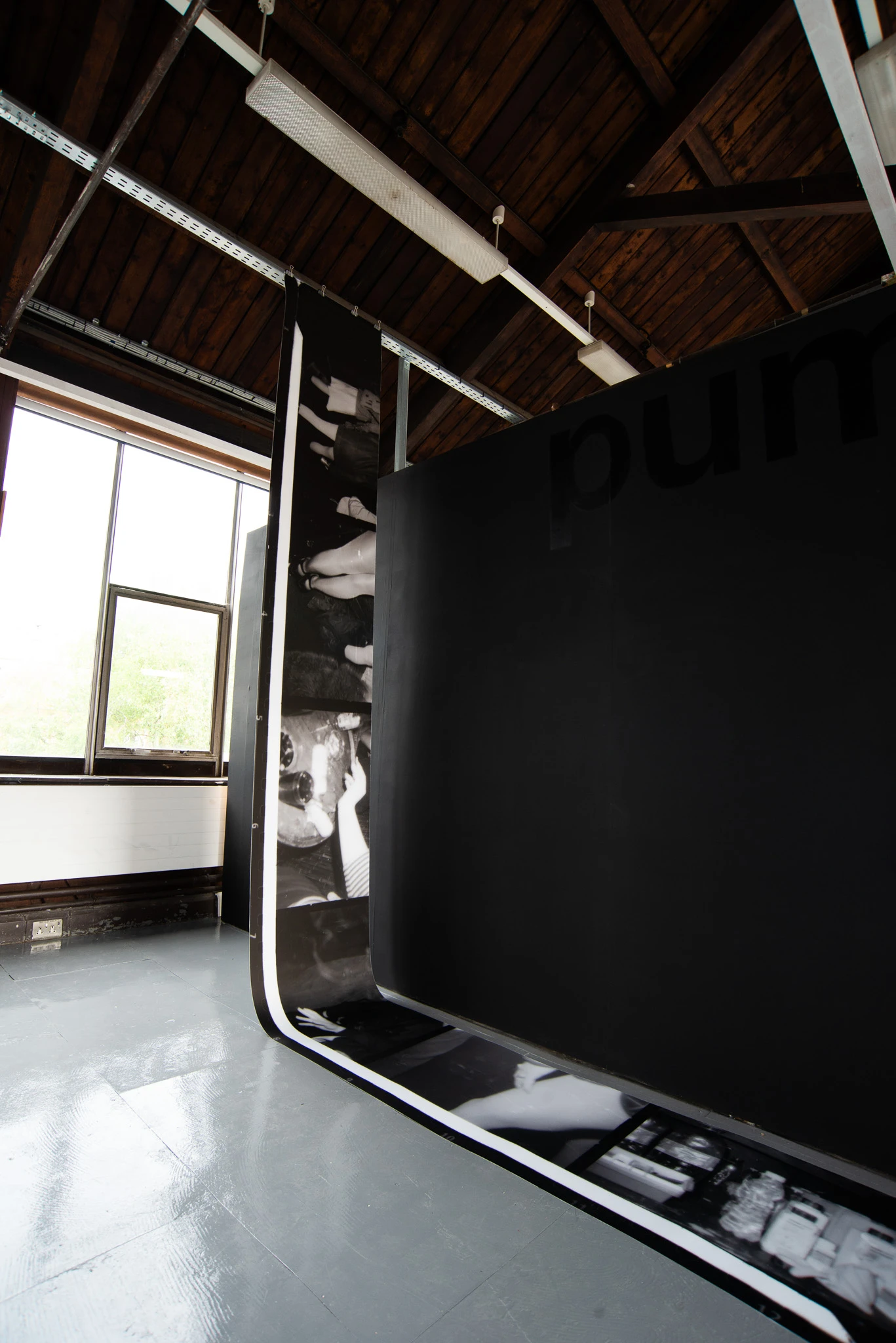 Printed image on lightbox film, 59 x 552 cm. 