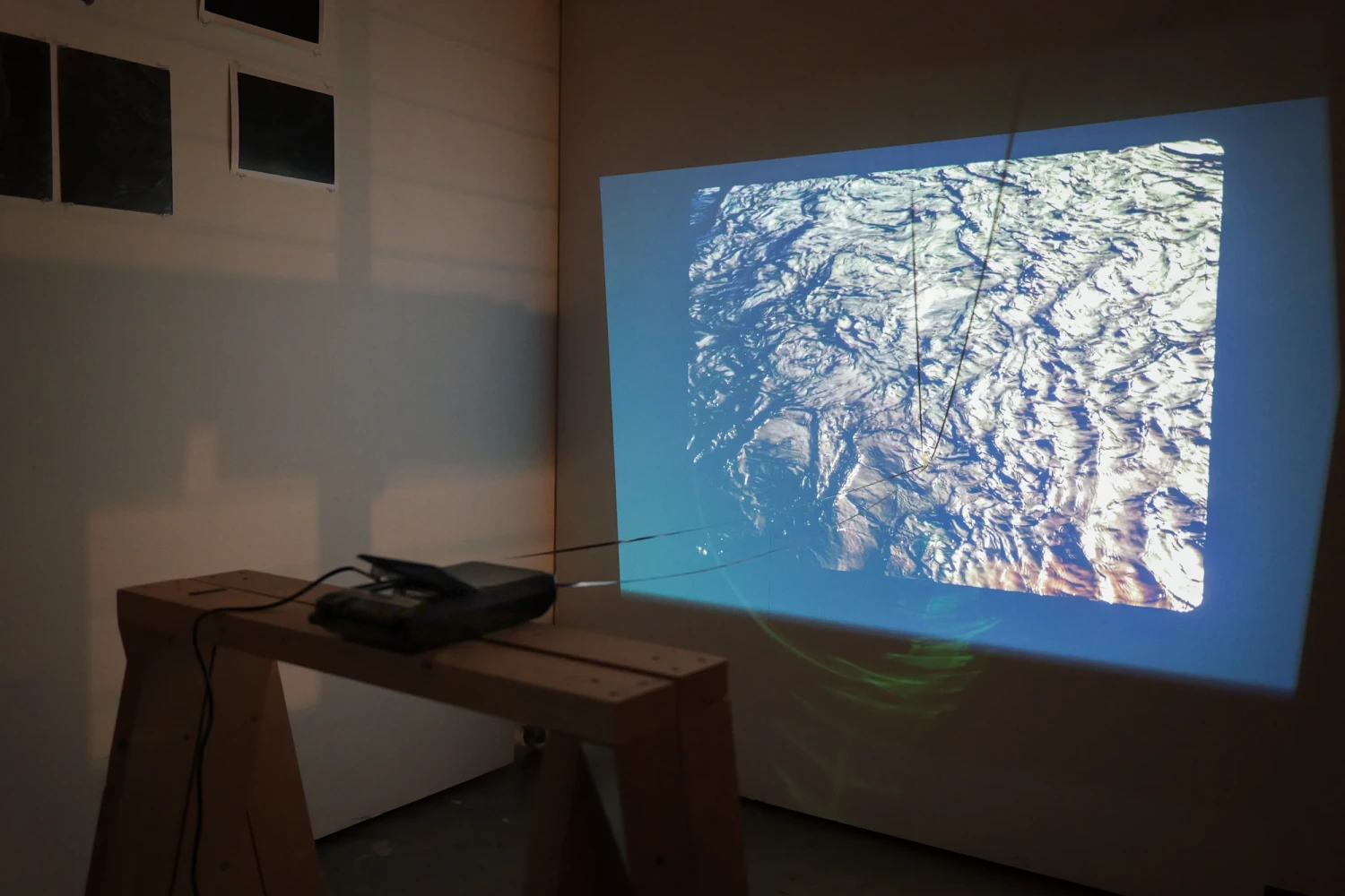 *Untitled*, from the project *Threads of a River,* 2026. Single channel video projection with tape based sound sculpture installation.