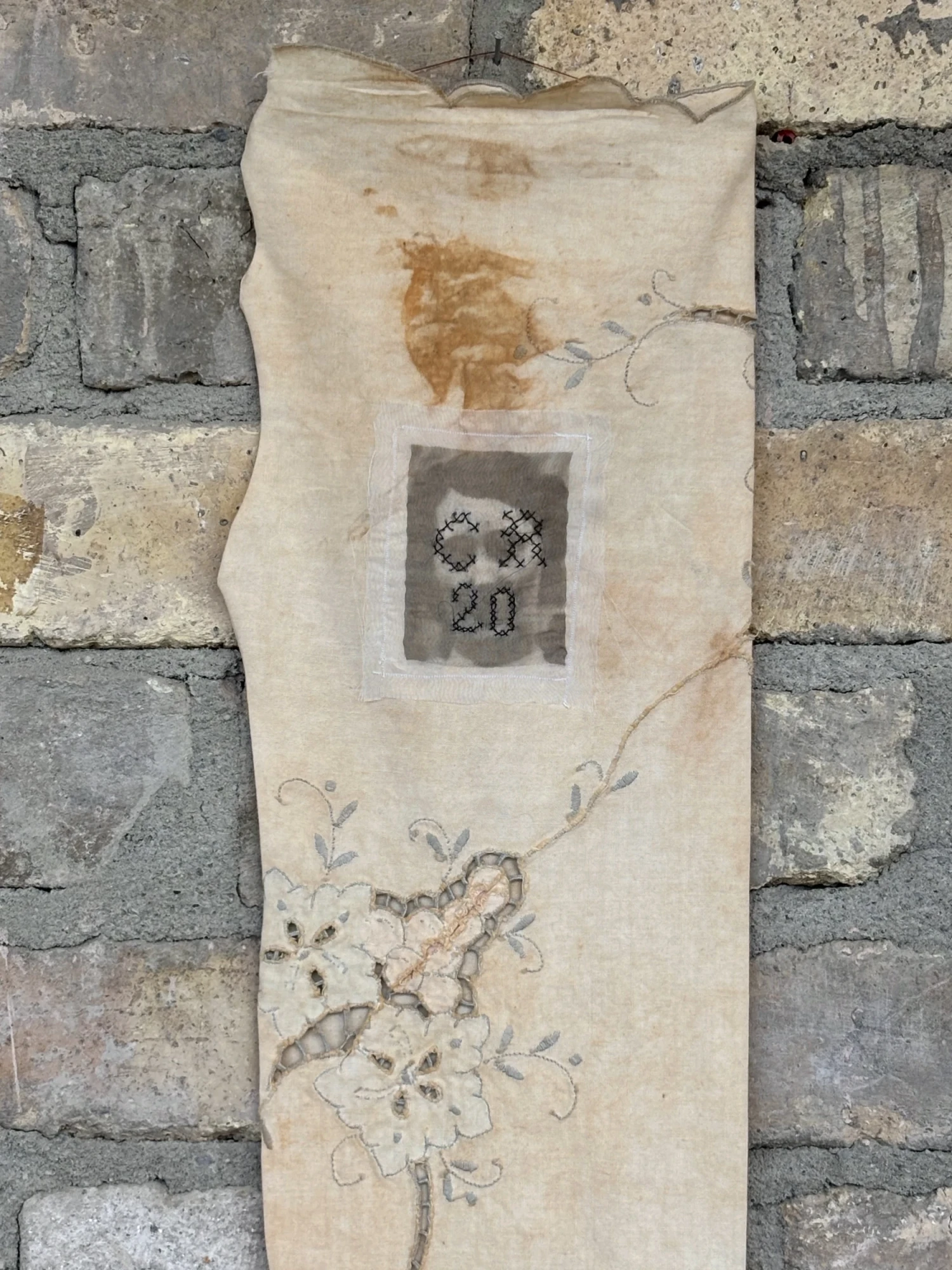 Hosiery worker, rust dyed stocking.