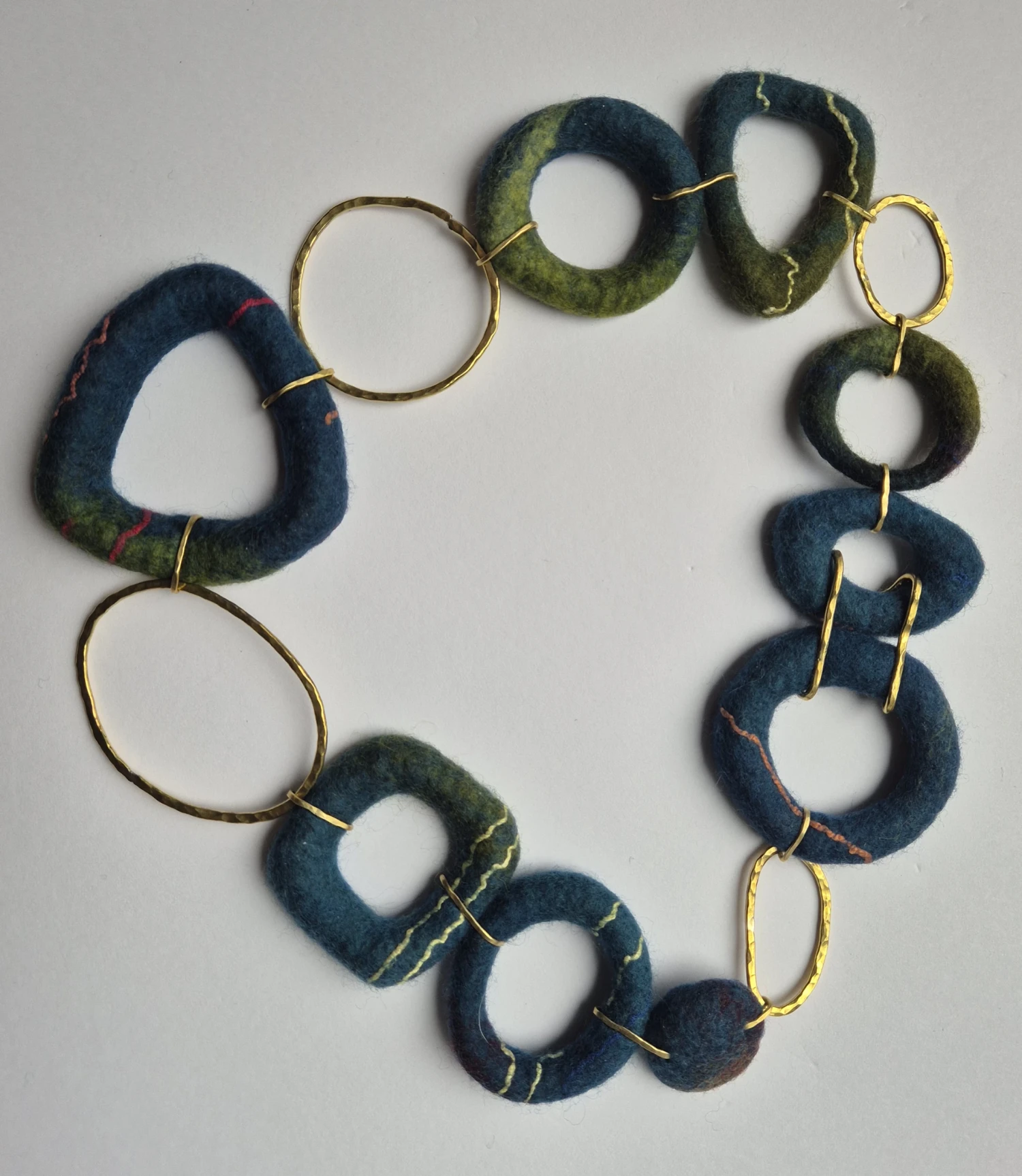 Necklace; Forged brass, silk thread and mixed media, dimensions vary