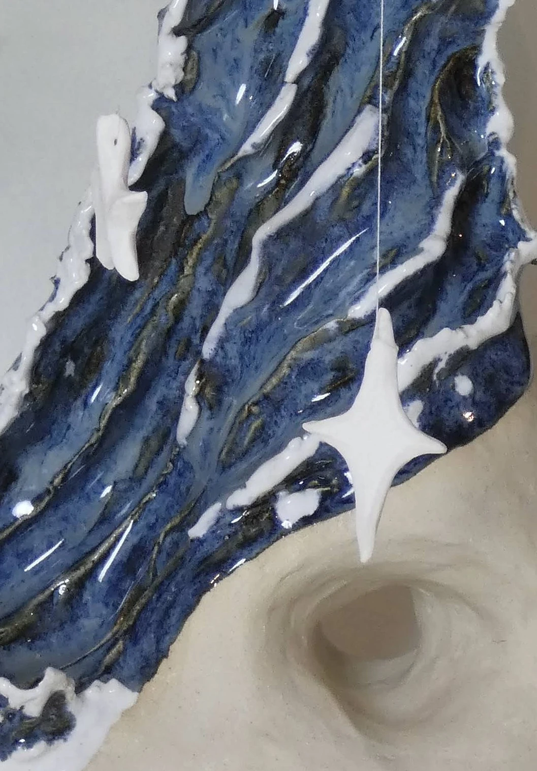 *Orbital Tension*, stoneware, porcelain and catgut, 35  x 25 x 25 cm.