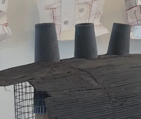 *Chimneys*, stitched cardboard, cardboard cones, clay paint, 500 x 550 x 500 cm.