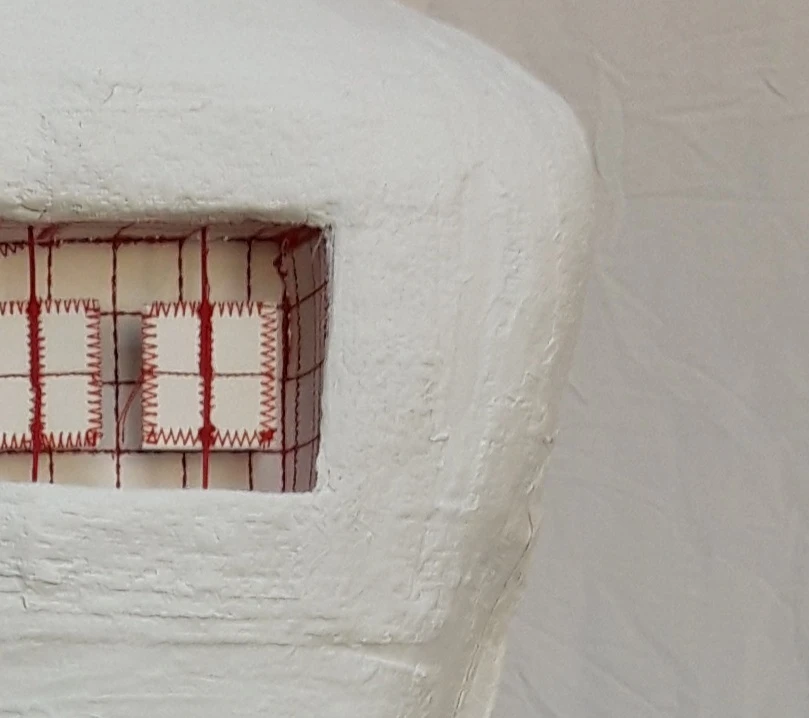 *Window*, plaster, packaging card, stitching, wood dowels, 450  x 600  x 200 cm.