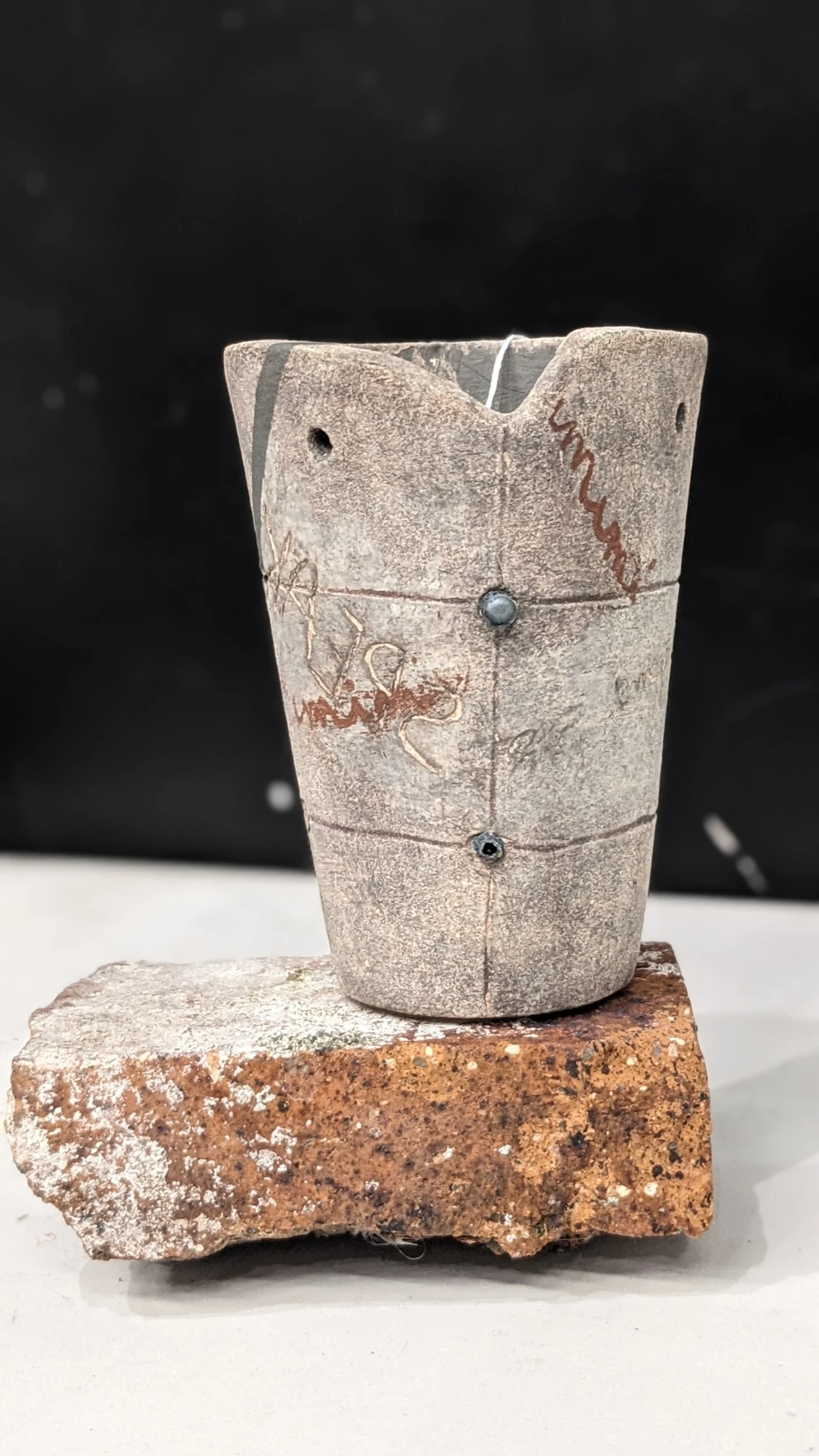 *Between Unity and Rupture*, stoneware with found brick, 11 x 8 x 8 cm.