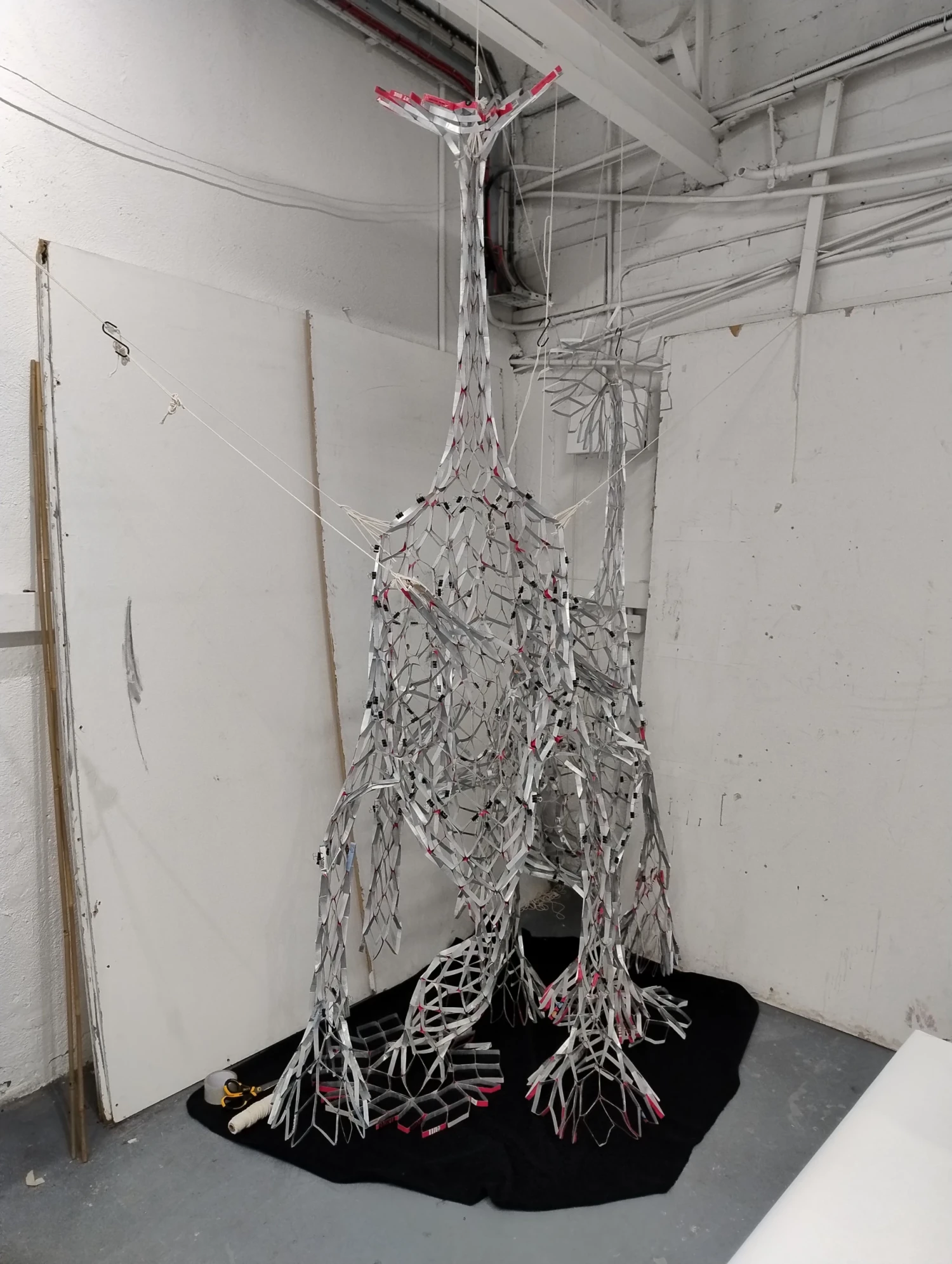 *Reciprocal Space,* beverage cartons, tape, gesso, 280 x 180 x 90 cm.
