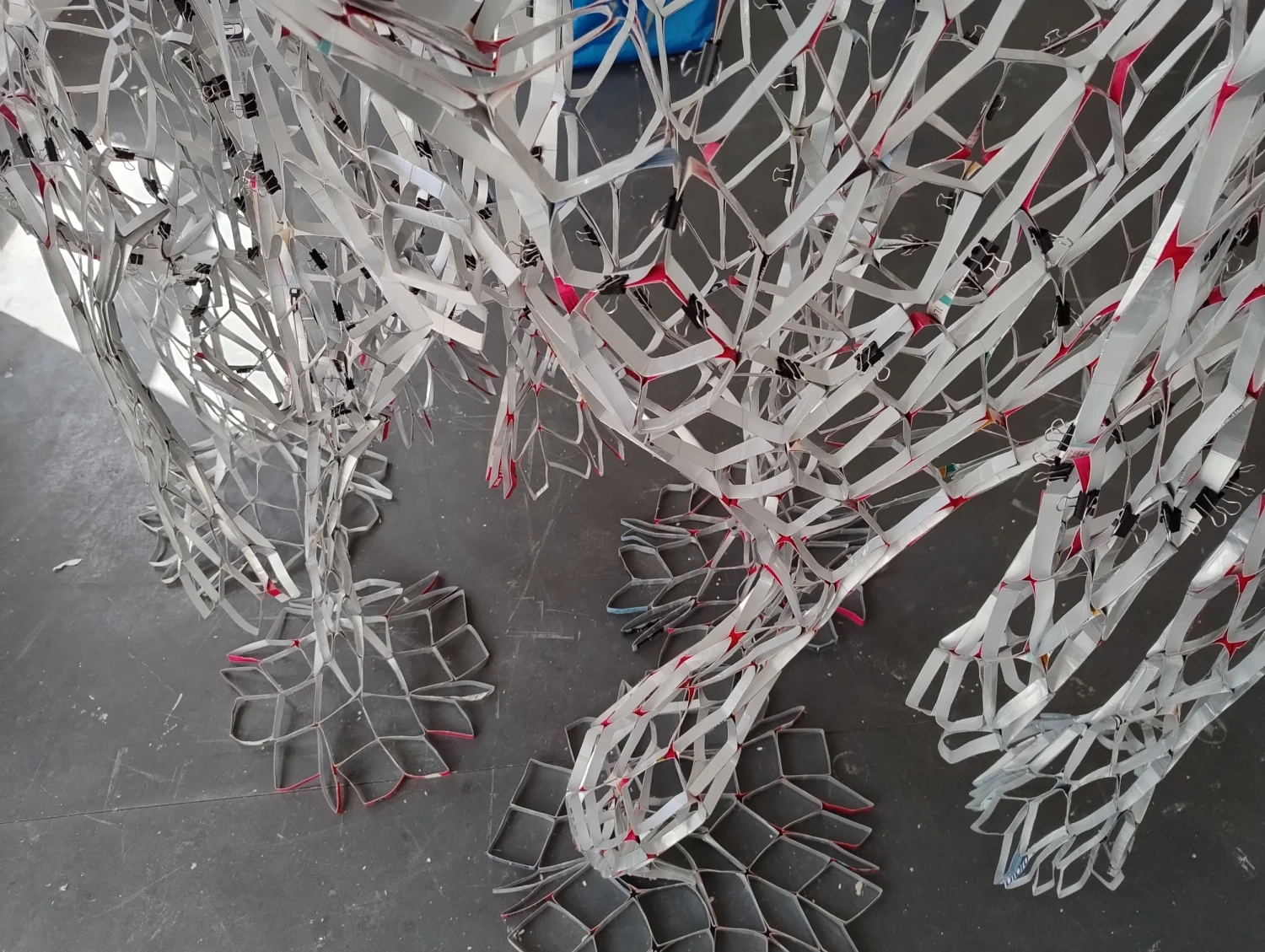 Close-up detail, *Reciprocal Space*, beverage cartons, tape, gesso, 280 x 180 x 90 cm.