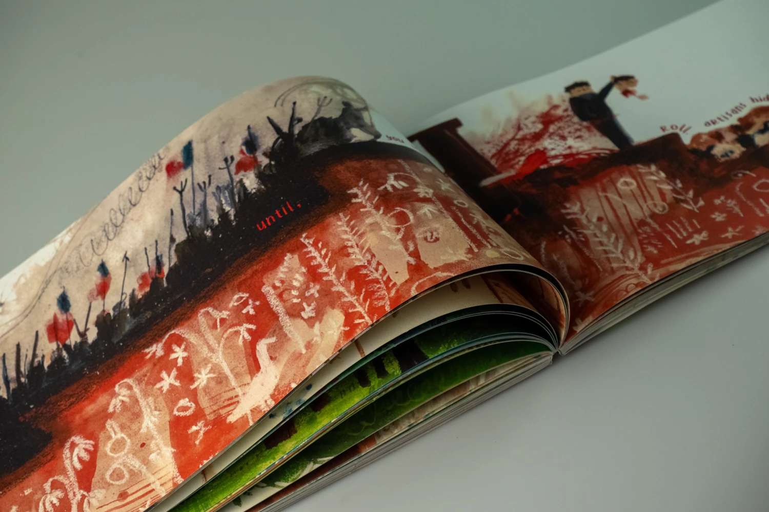 Close-up of spread, *Until, you made heads roll. Artisans hid under air thick with gunpowder and iron*.