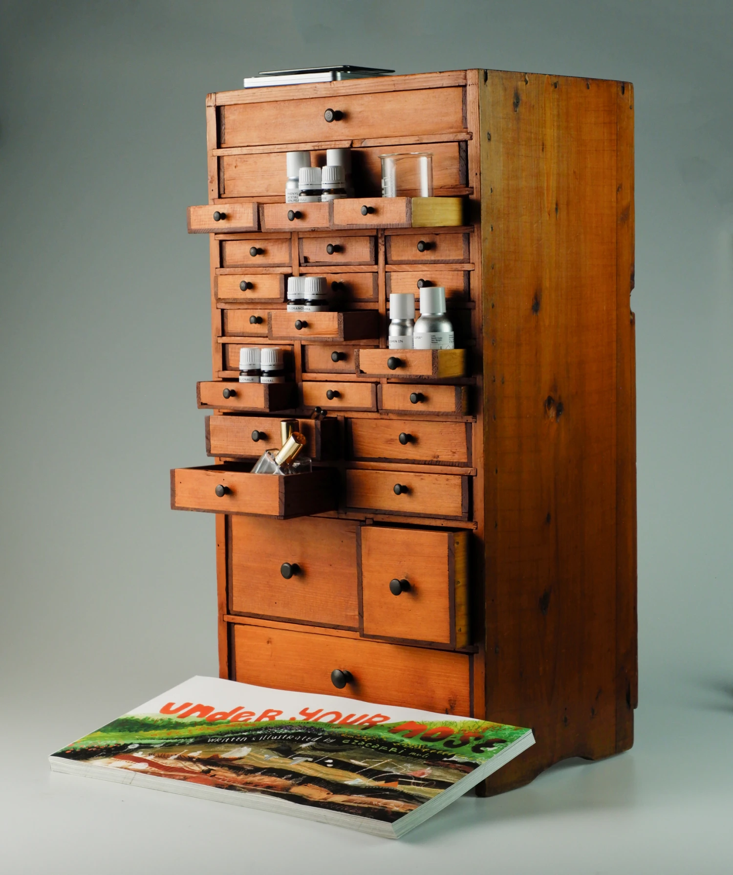 *Scented Cabinet*, single aromachemical fragrances and 120 page book.