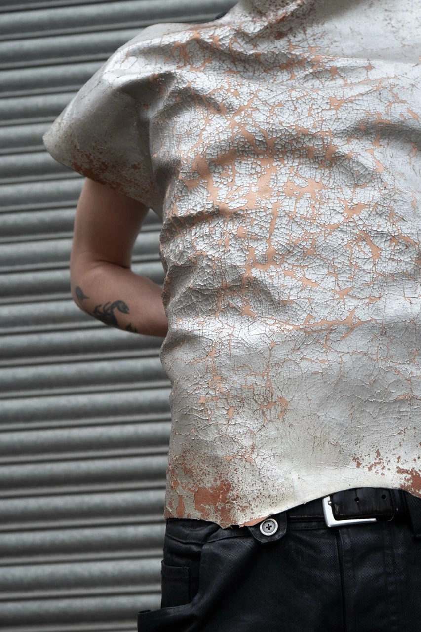 Screen printed pigment, developed cracked effect on goatskin.