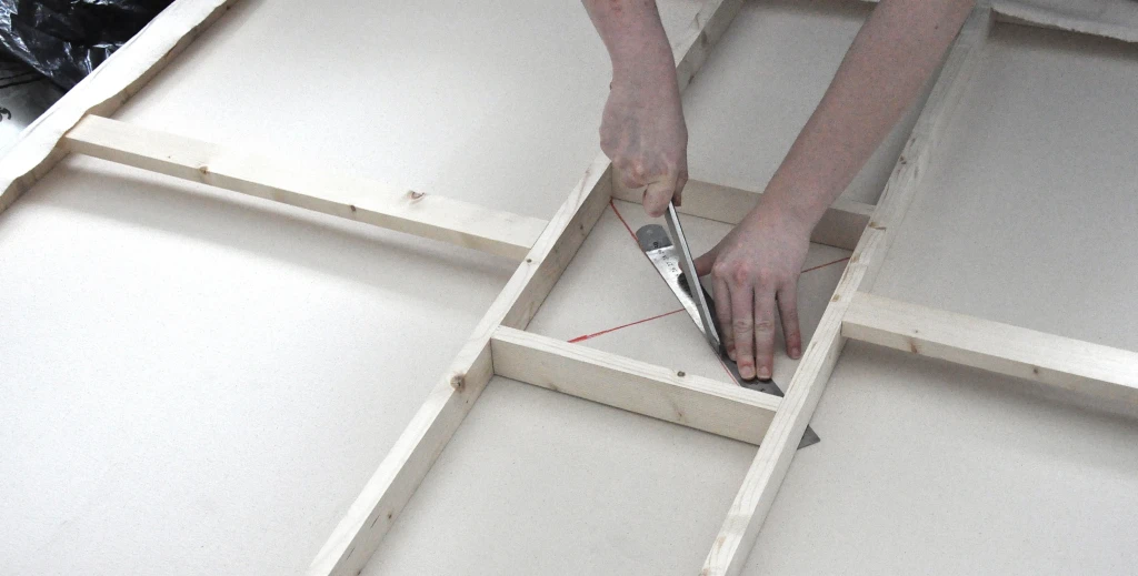 Cutting into canvas to create depth for the shelf.