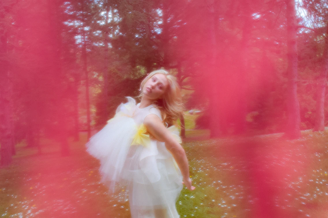 *Look 3*, silk organza bodice with puff of tulle, veiled in organically shirred organza panels.