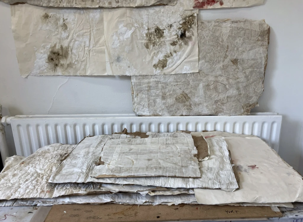 Preparation of layered handmade surfaces in studio.
