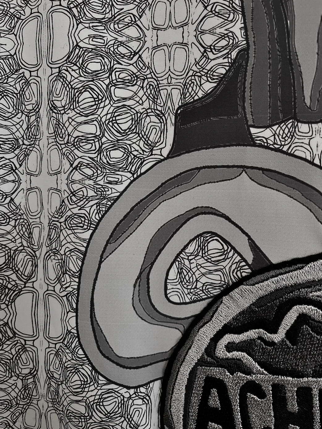 Close-up of heat press and multi-head embroidery.