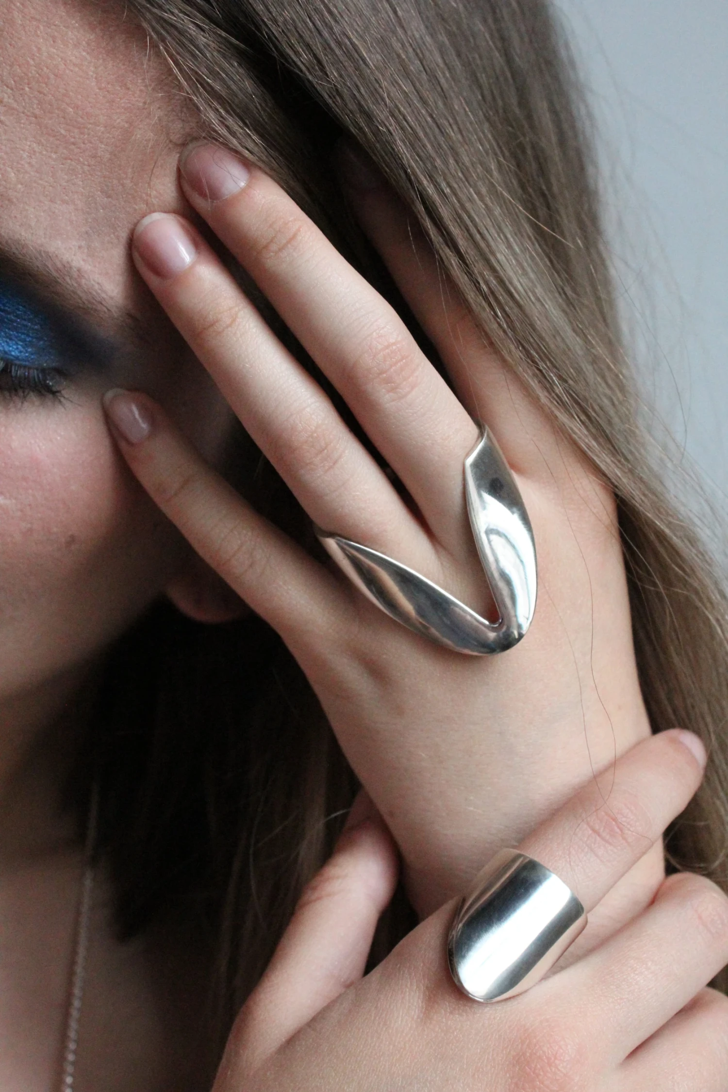 *The Dip*, ring (top) sterling silver; *Layered* ring (bottom) 935 sterling silver and etched 935 sterling silver.