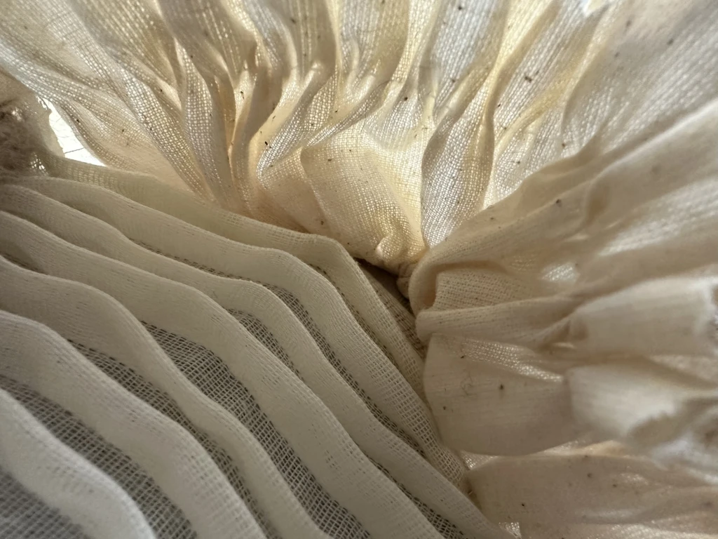 <p>Smocked calico with pleated muslin. </p>