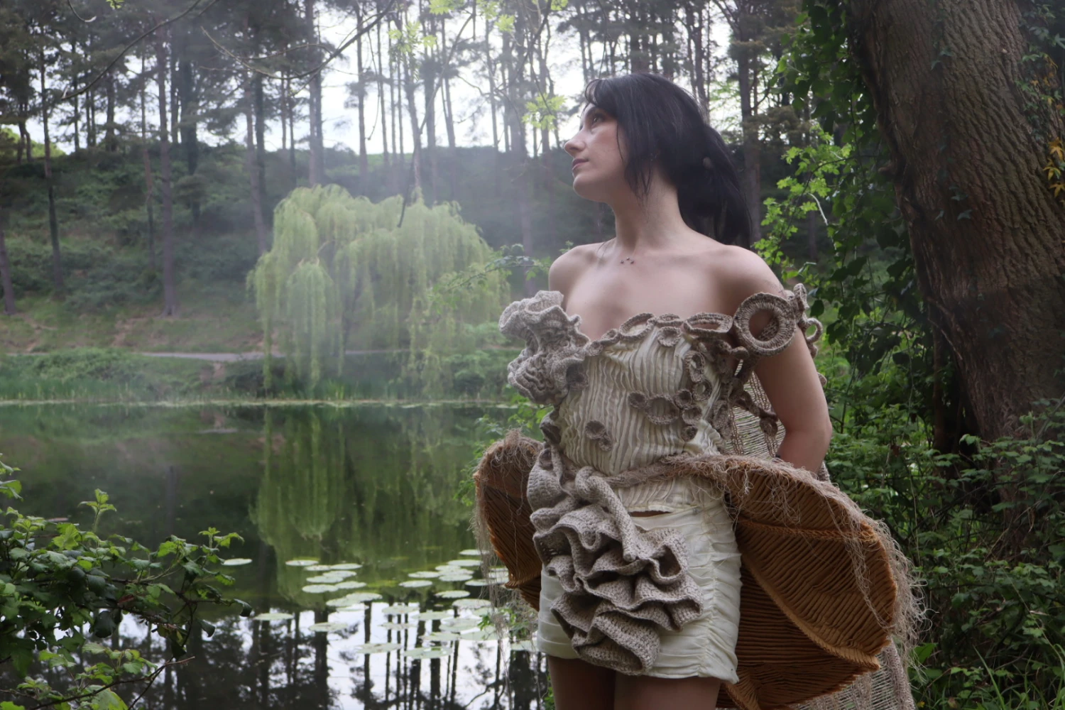 Smocked and pleated muslin top and skirt. Pleated calico overskirt, naturally dyed using mushrooms. Crochet detailing and knitted shoulder piece in Donegal yarn.
