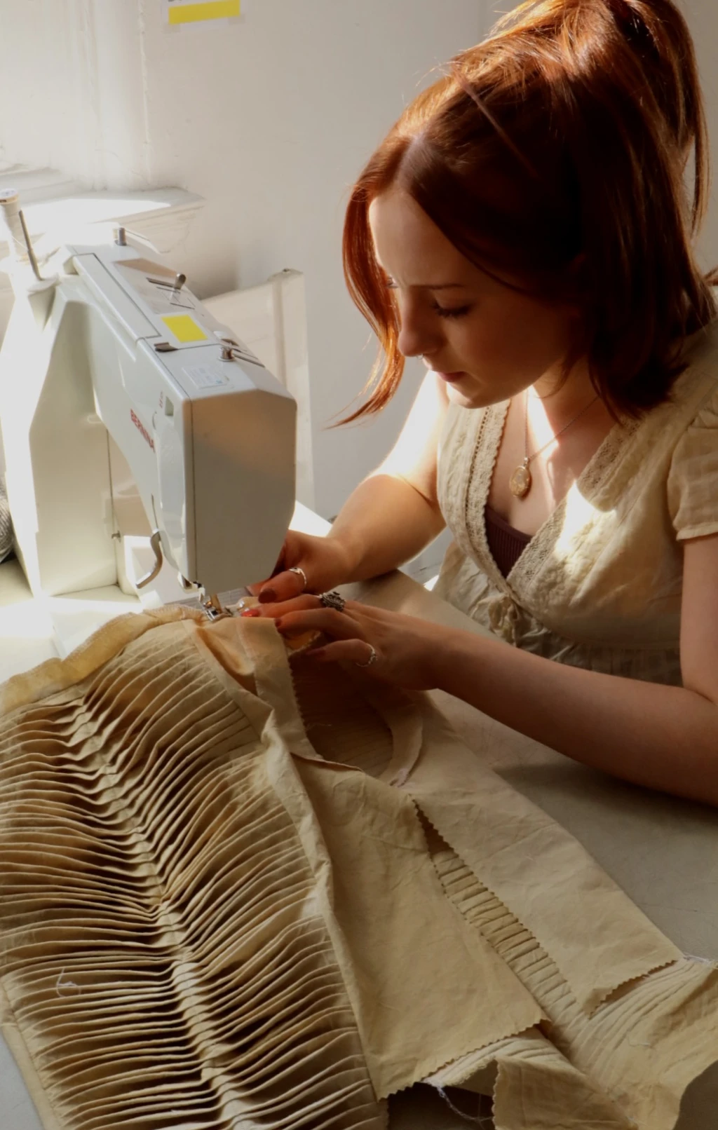 <p>Pleated bodice, naturally dyed using dyer’s polypore mushrooms.</p>