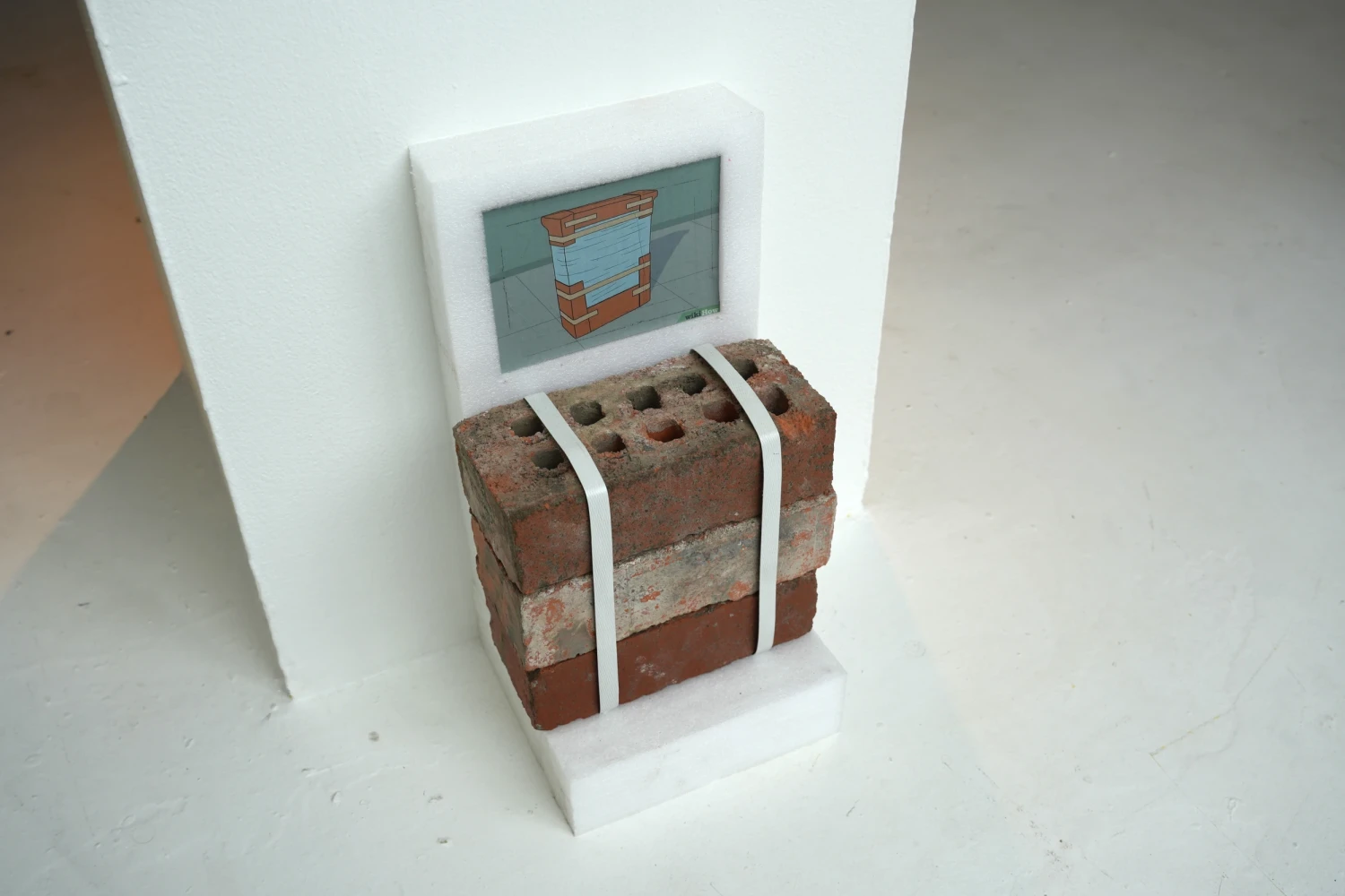 Temporary Architecture, 2026, Wiki-how instructional illustration, brick, polyethylene foam, cardboard, plastic strapping. 