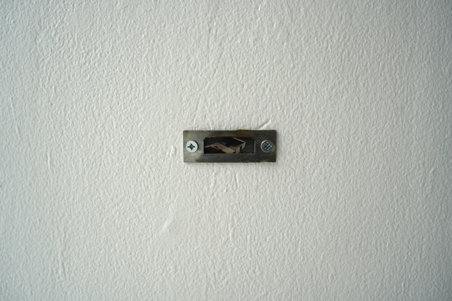 Unboxing 2, 2026, printer paper, found door latch.