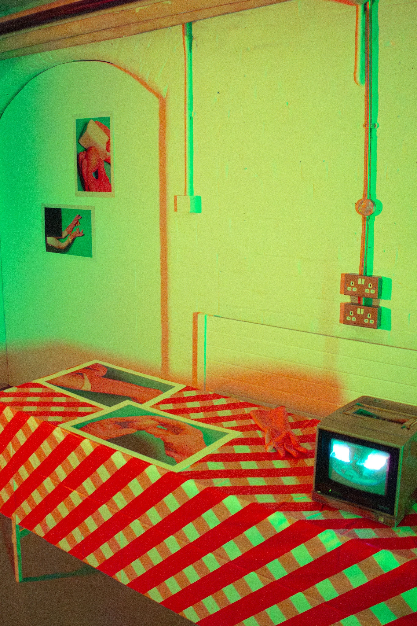 Installation view, GUBBER ROVE, four Hahnemühle Metallic Rag archival paper prints and a video playing on a Sony broadcast monitor,  29.7 x 42.0 cm each.