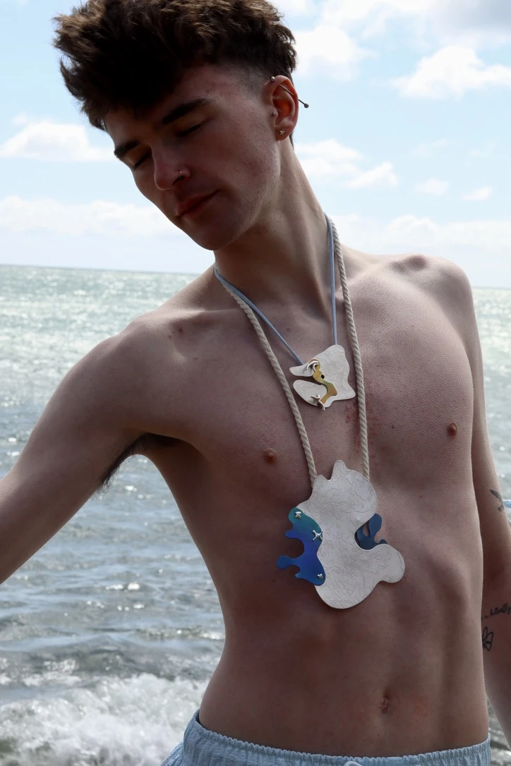 *Fragments of Tides* pendant #1 & *White Rock* pendant #2, 925 sterling silver, anodised niobium, chord, rope chain.