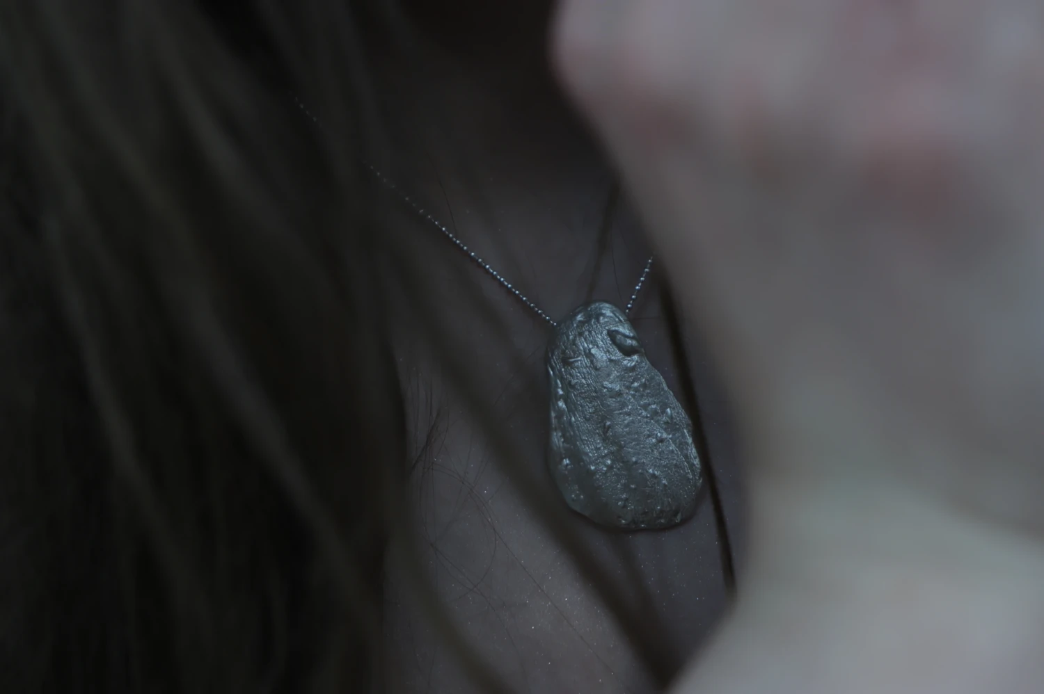 *Skin Memory*, wax-cast sterling silver pendant, created from a direct body impression.