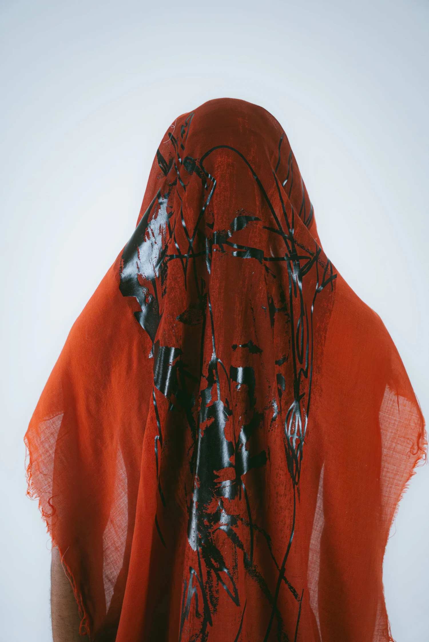 Reactive print overprinted with foil on fine wool mousselline.