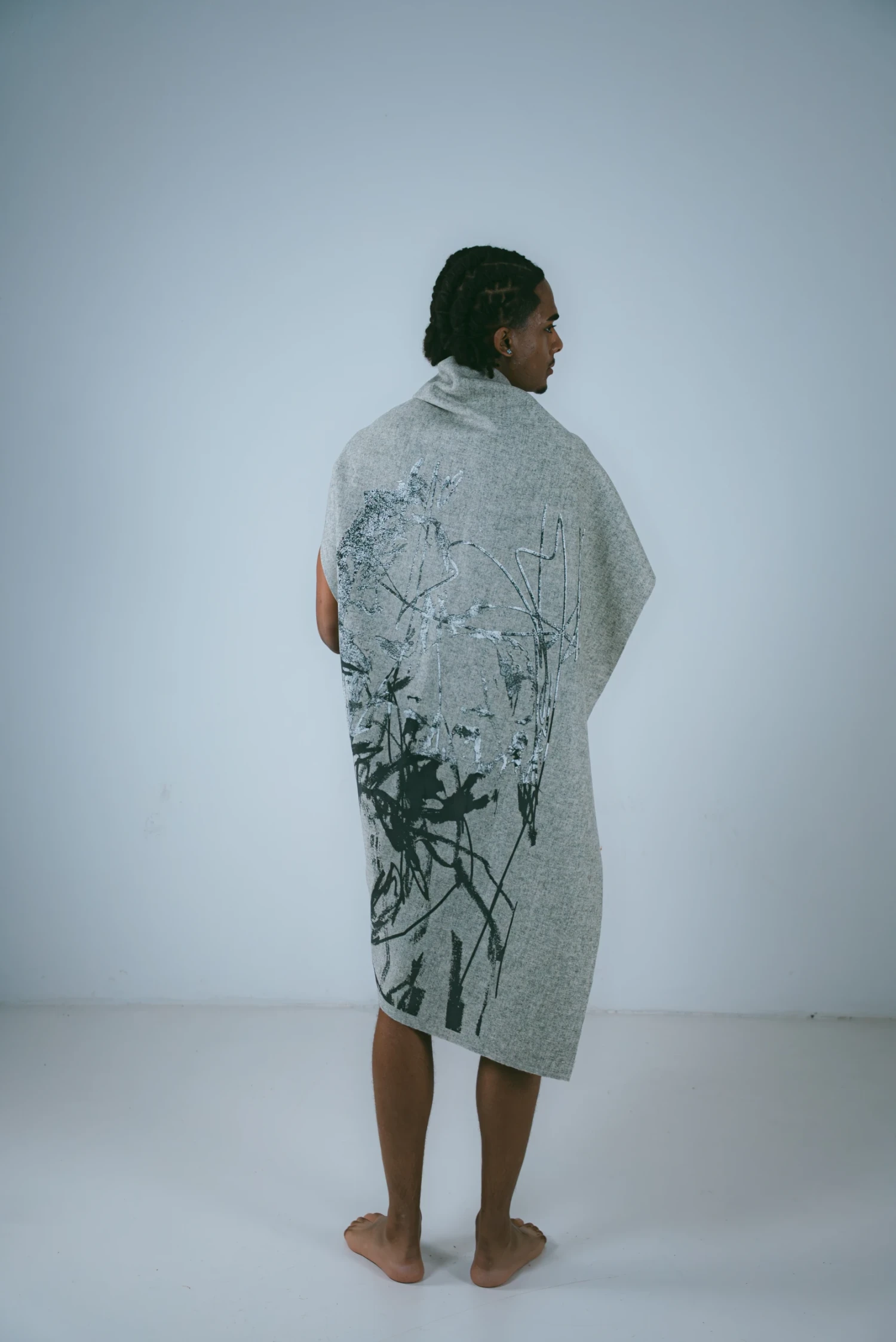 Dark grey opaque overprinted using white opaque, manipulated to achieve cracked affect on heavy furnishing wool.