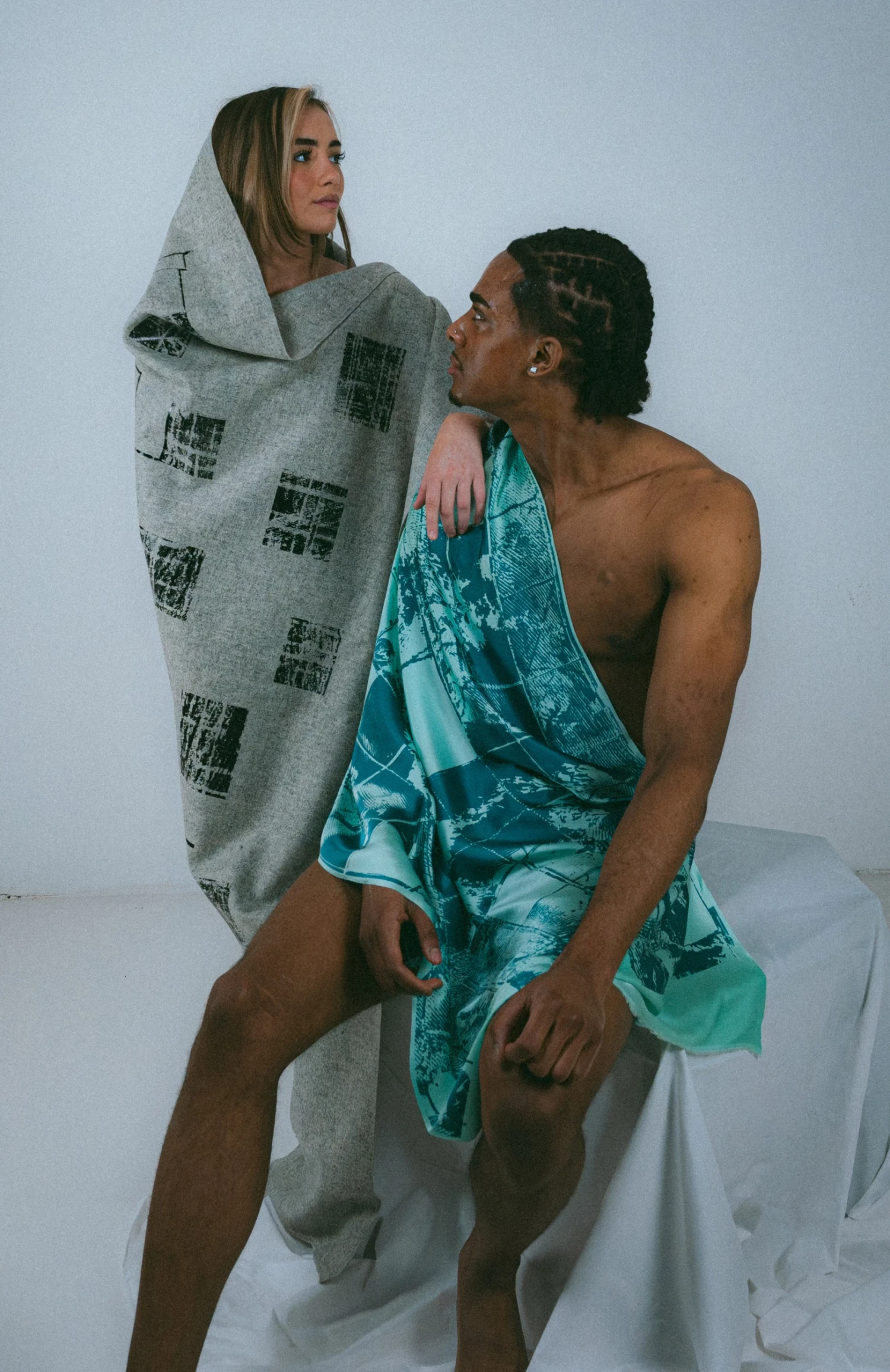(L-R) Foil on heavy furnishing wool; reactive print on Satin Crepe.