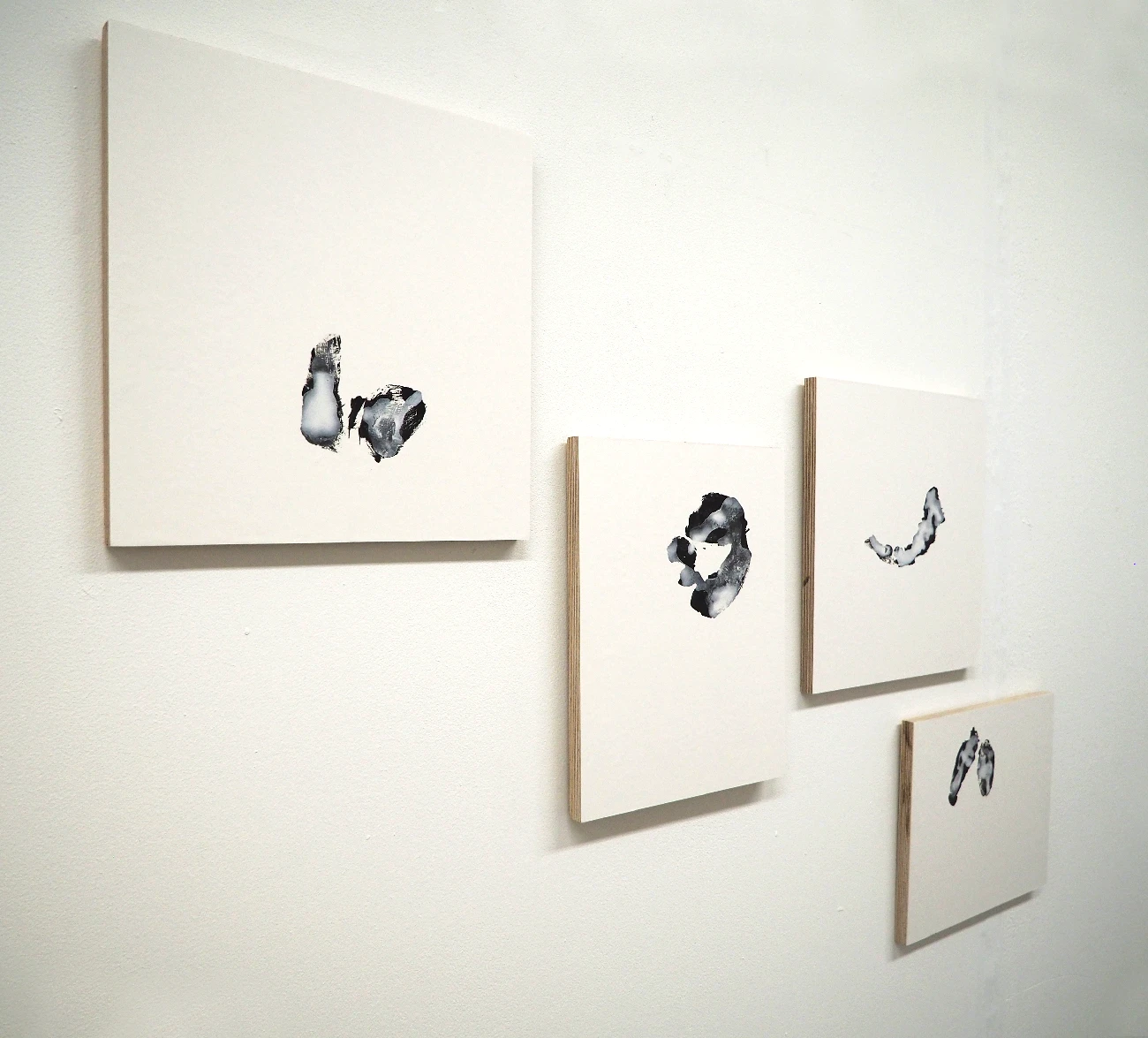 *Imprints* 1-4, paper porcelain clay dust sediment on blackboard paint, dimension vary.