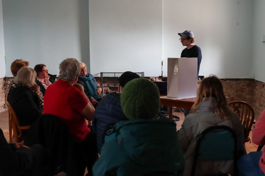 Public storytelling session at Camp Community Centre, Co. Kerry. Residents gathered to interact with the robot and share stories.