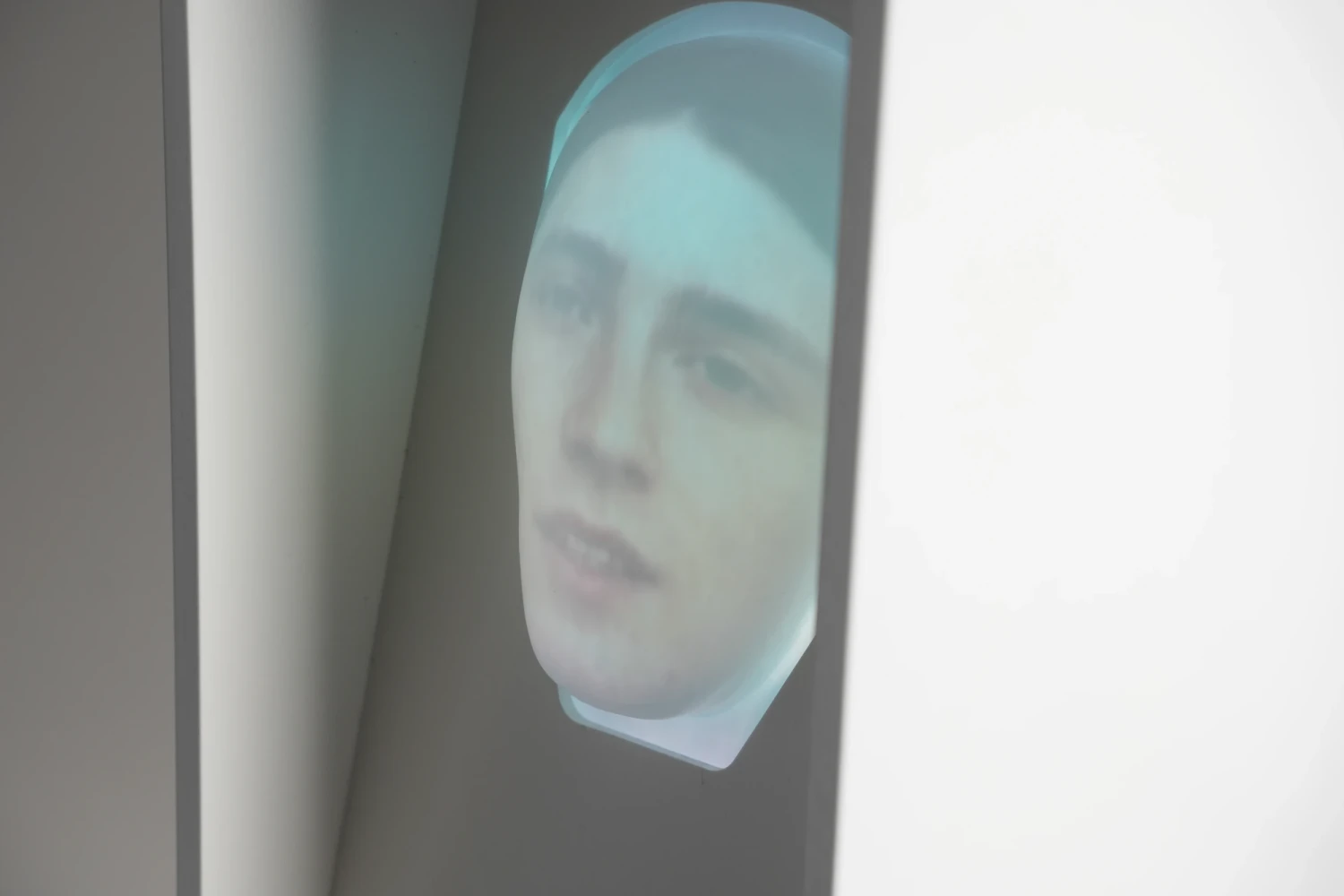 A real-time reactive face projected onto a vacformed mask, housed inside the artefact.
