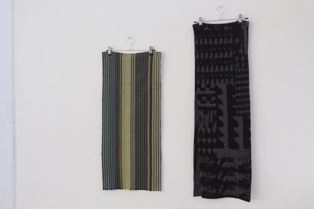 (L-R) *Gritty* check, lambswool; *Segments* scarf, acrylic.