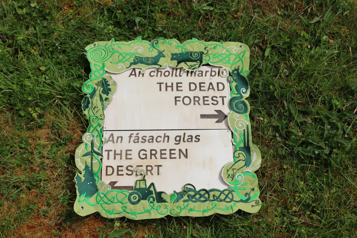 Signs made of plywood and heavy embroidery.