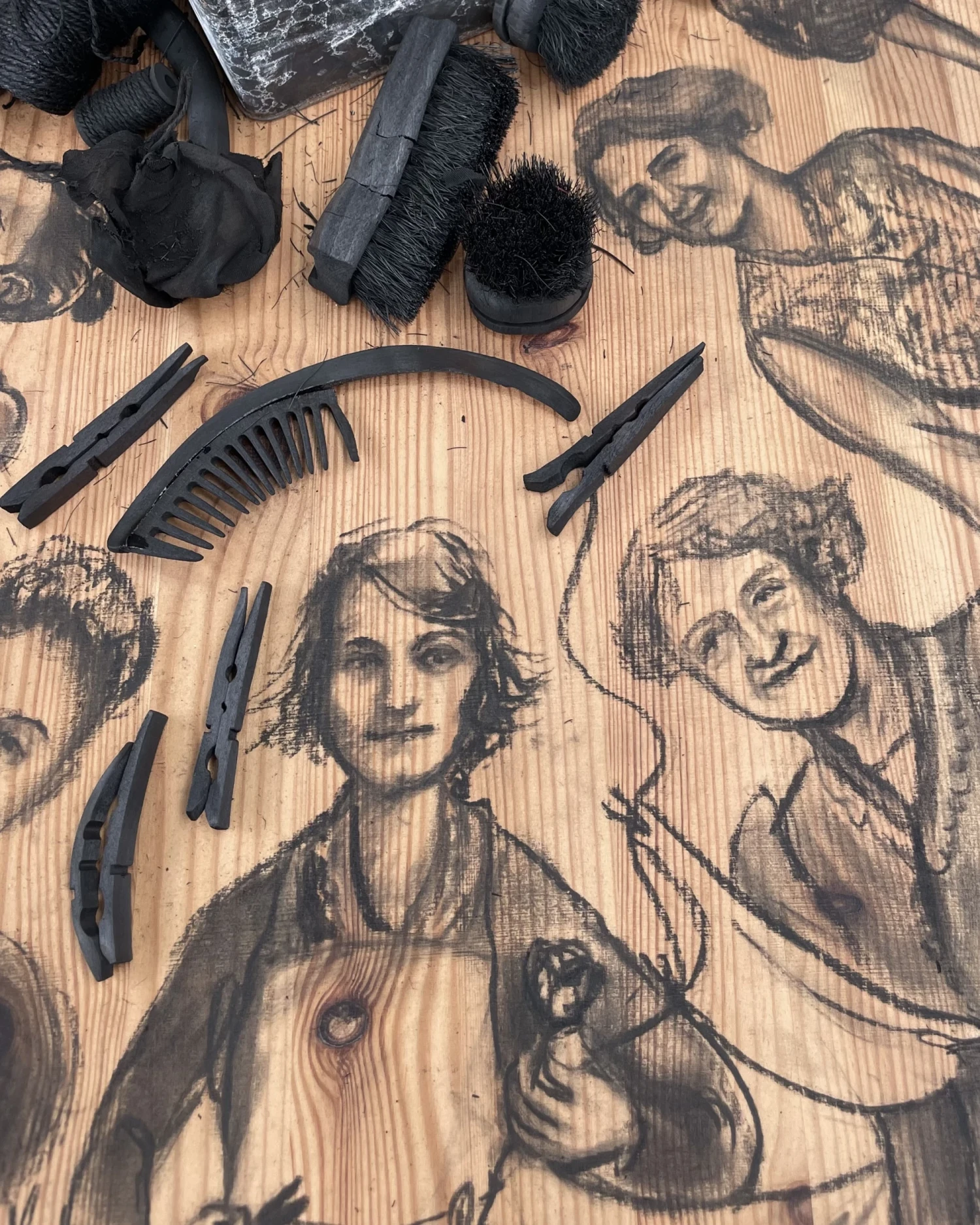 Close-up detail, *Hestia’s Kitchen Table*, charcoal drawings and charcoal on found wood table, 120 x 75 x 75cm.