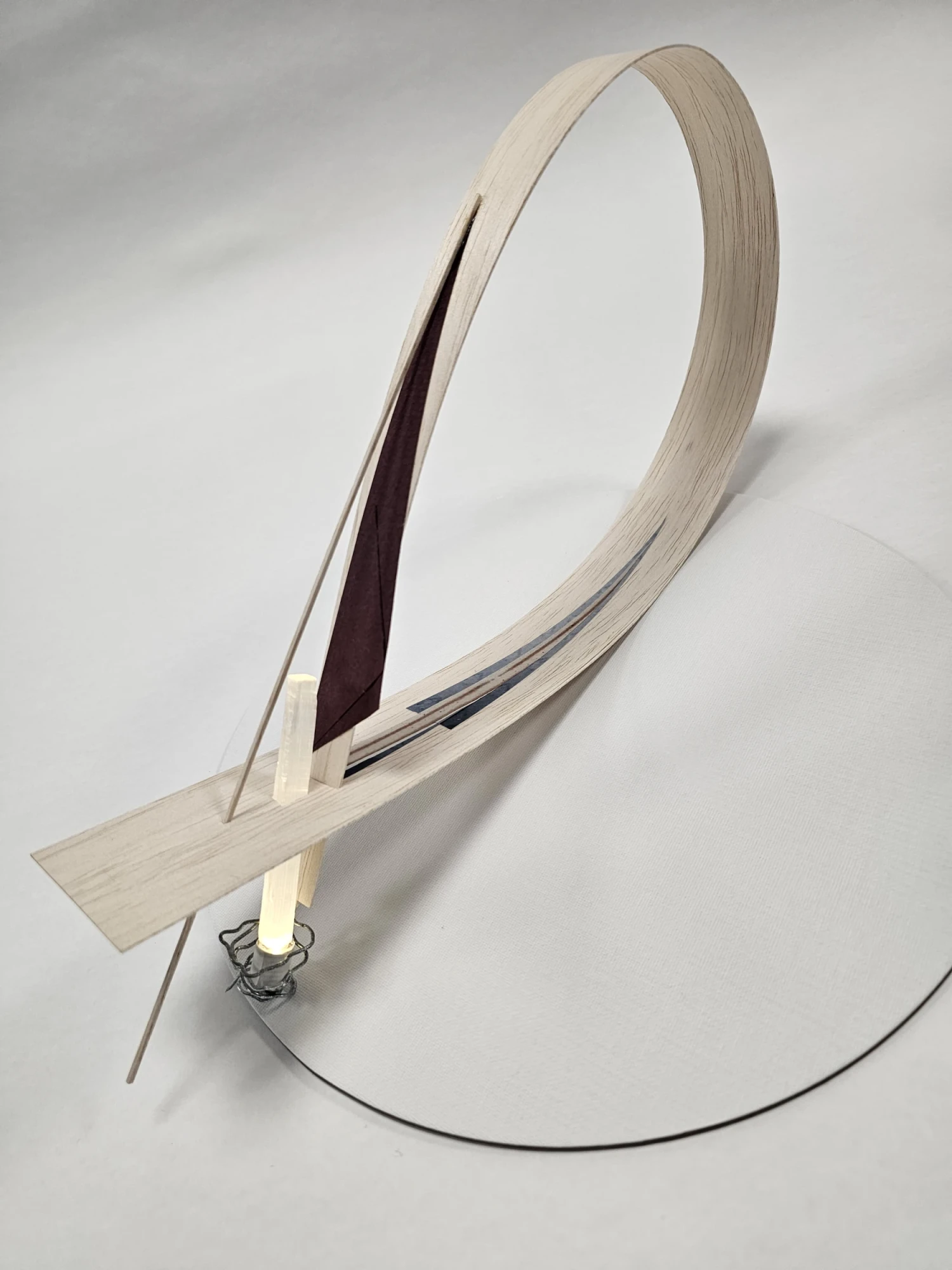 *Fragment V - It All Circles Back*, balsa, wire, collage, selenite rod, LED, 37 x 20 x 6 cm.