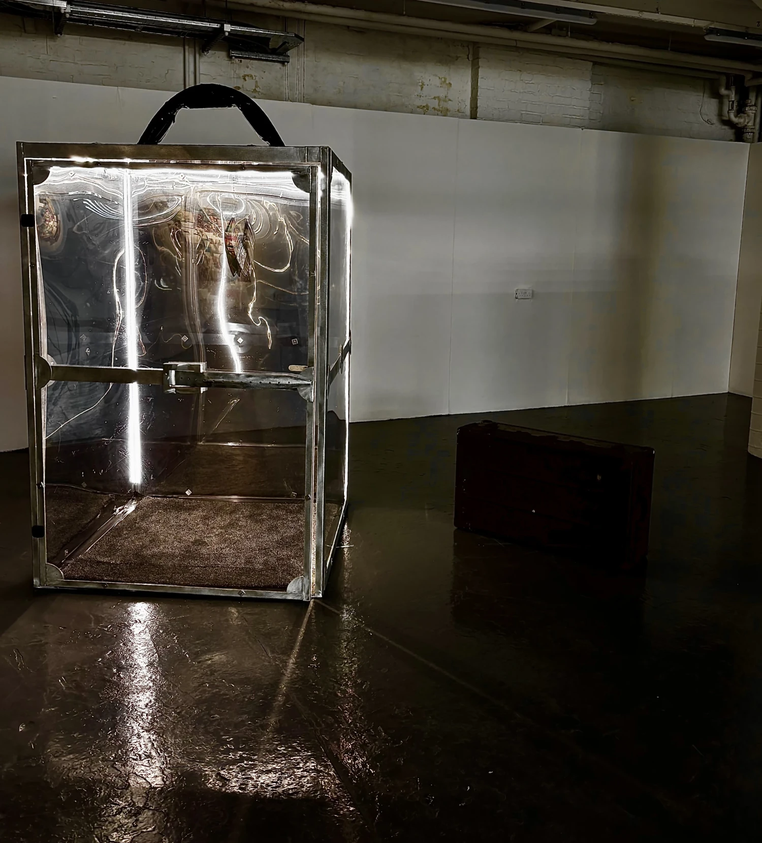 *Social Notions*, aluminium frame, polycarbonate with vinyl film, LED lights and acetate zine, 182 x 120 x 120 cm.