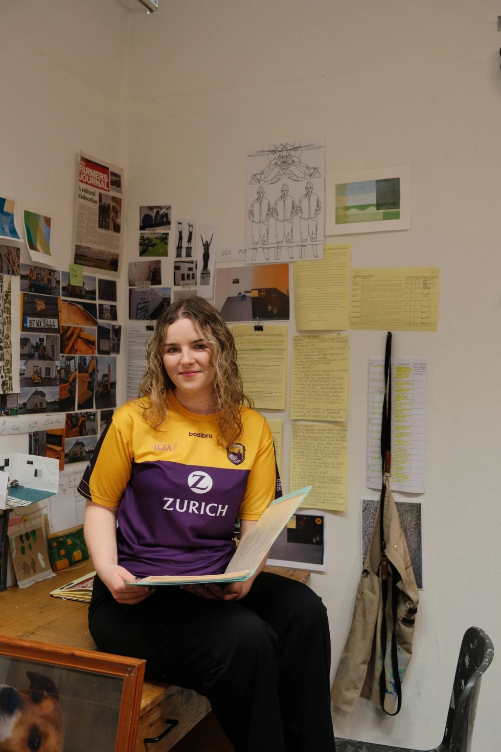 A studio portrait of the artist in process, reading and revisiting the script as part of an ongoing development of the work.