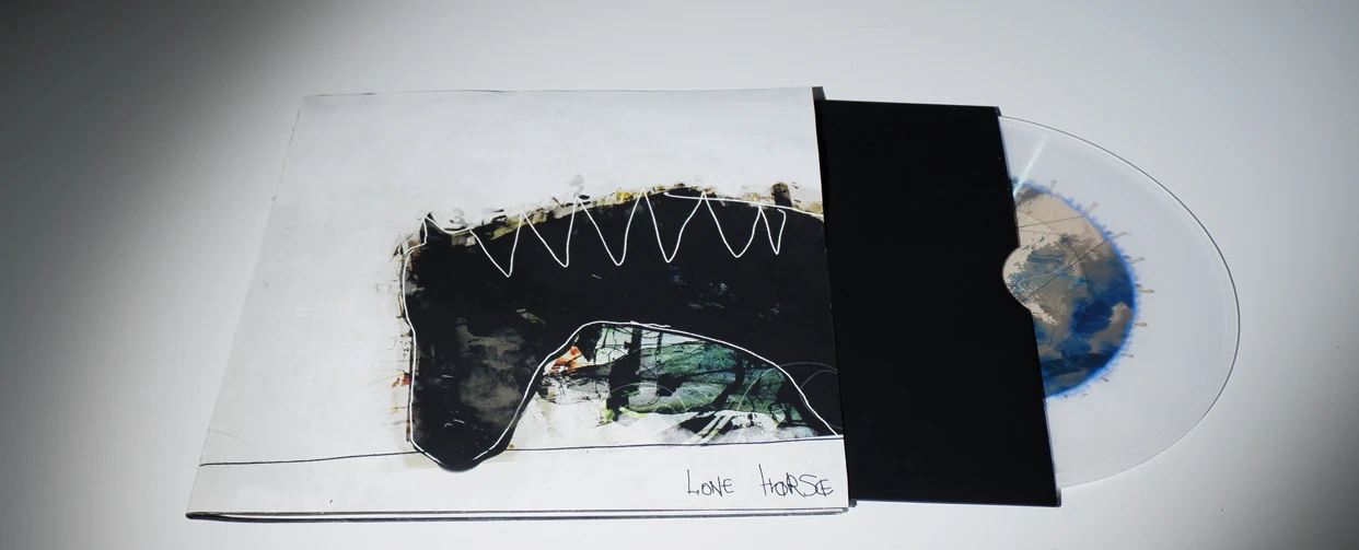 *Lone Horse*, vinyl depicting the sound of loneliness. Violin provided by Lain Tsang. The audio mimics the stages of hearing loss that occur within people experiencing chronic loneliness.